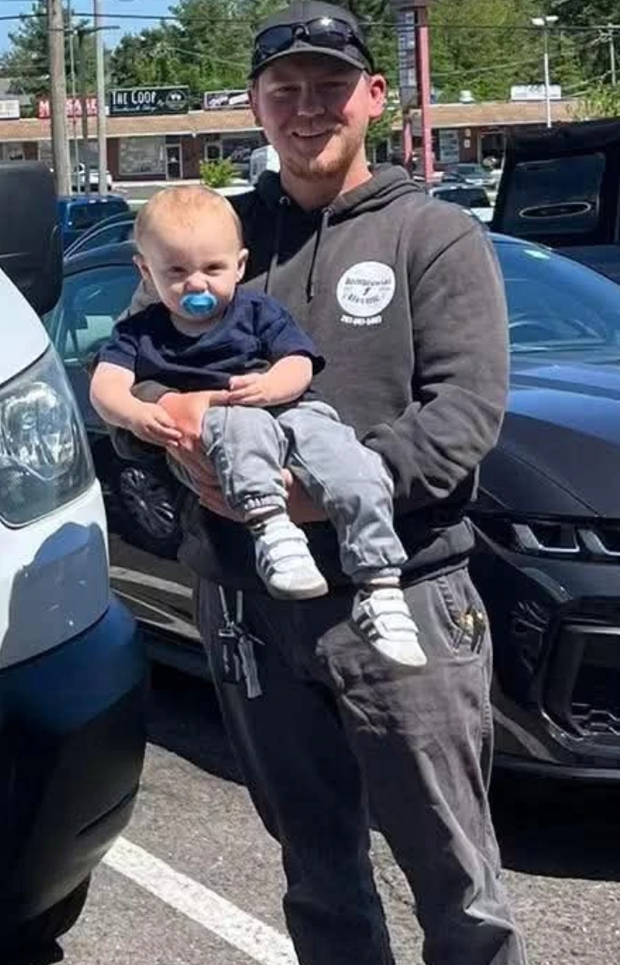 Kyle Dombrowski, owner of Dombrowski Electric, with his son